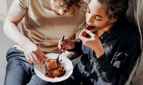 Millennials eating sustainable, ethical, responsible chocolate pancakes
