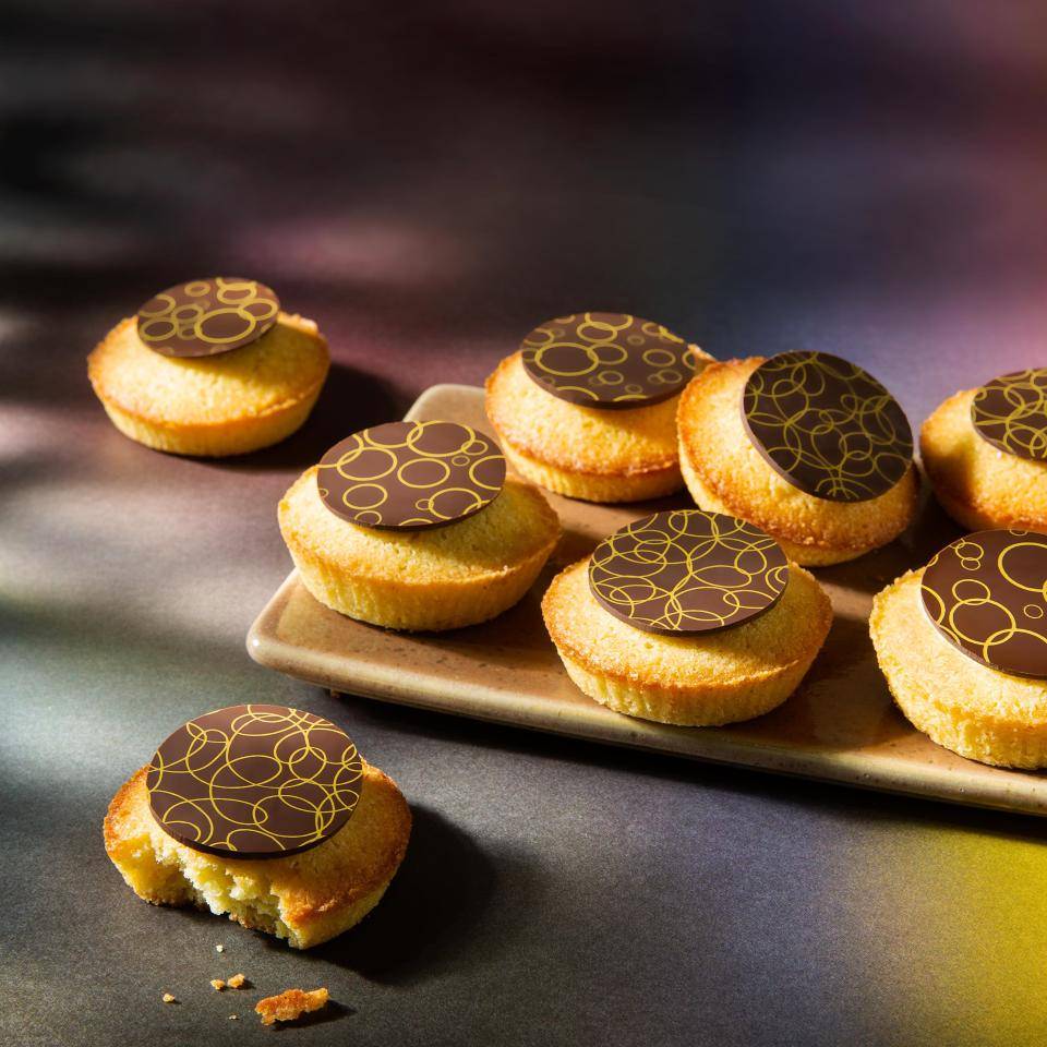 Cupcakes with a printed chocolate plaque on top