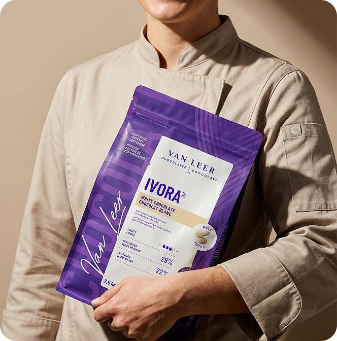 Artisan with a bag of Van Leer Ivora chocolate