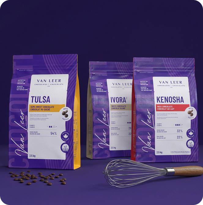 3 Van Leer bags of chocolate and a spatula on purple background